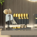 Clear PET rotating makeup organizer box holding lipstick tubes and brushes, shown from a front angle on a white background