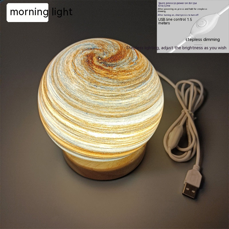 USB lantern night lamp casting a warm rainbow sunset glow on a table as ambient mood lighting