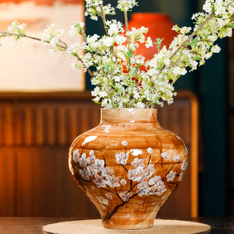 White ceramic hydroponic flower vase with minimalist design, ideal as a decorative home accent for modern interiors.