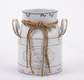 White decorative iron bucket with European-style design, ideal as a rustic home décor accent for flowers or storage