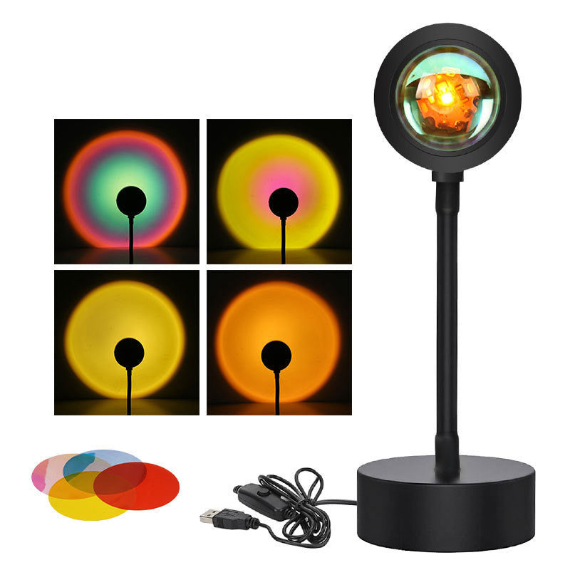Sunset Projection Lamp casting a warm rainbow gradient light across a dark room, showcasing its ambient mood lighting effect