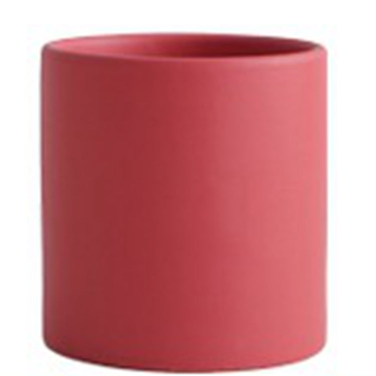 Colorful cylinder ceramic succulent planter with drainage hole, shown in a Nordic-inspired style for small indoor plants