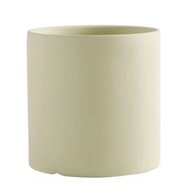 Colorful cylinder ceramic succulent planter with drainage hole, shown in a Nordic-inspired minimalist style