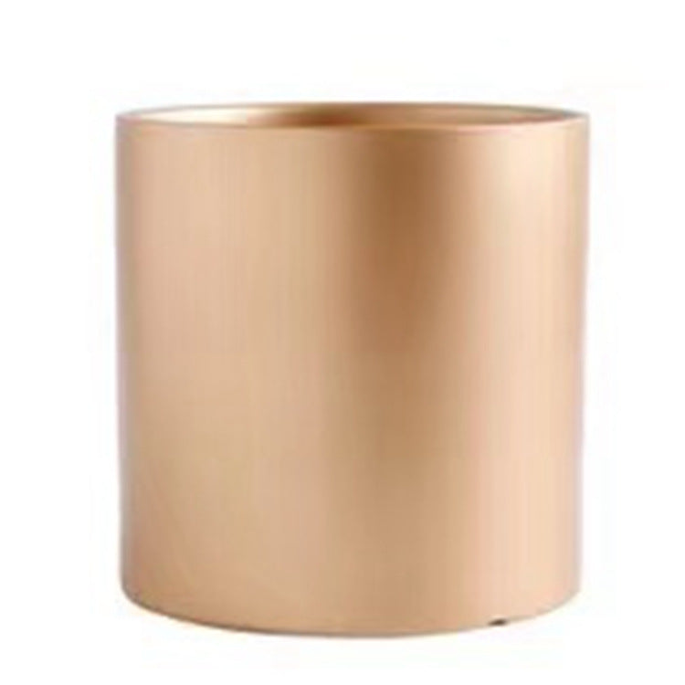 Colorful cylinder ceramic succulent planter with drainage hole, shown in a Nordic-inspired minimalist style