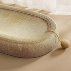 Oval sisal cat scratcher bed with textured scratching surface and cozy lounge nest design for cats
