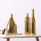 Gold-plated ceramic desktop vase with a glossy finish, shown as a modern decorative accent for home or office styling