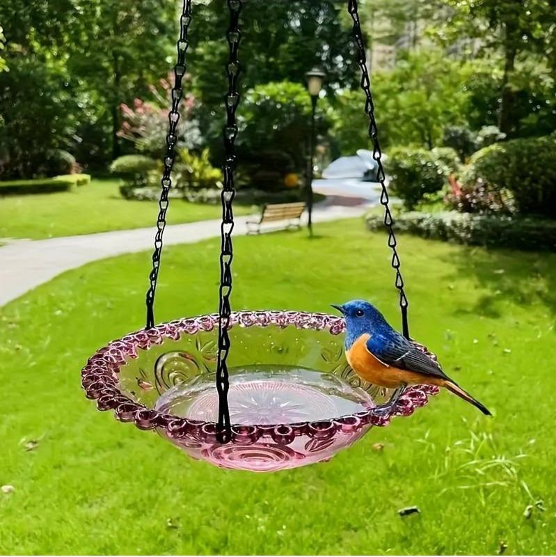 Hanging bird bath and feeder bowl with water, shown suspended outdoors in a garden setting