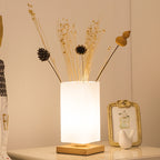 Solid wood table lamp with a Nordic minimalist design, featuring a natural wood base and warm ambient desk light