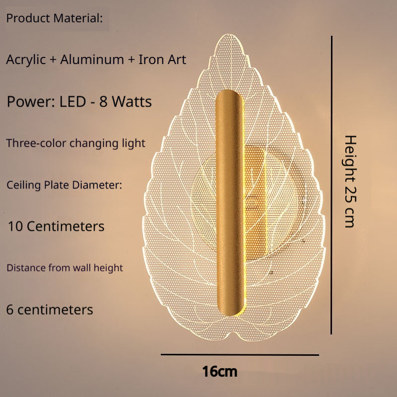 Modern minimalist leaf-shaped wall sconce with tri-color LED lighting mounted on a white interior wall