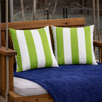 Green and white 18x18 outdoor throw pillows displayed on a patio chair, waterproof cushions sold as a 2-pack