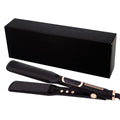 Negative ion flat iron gliding through dark hair, showing smooth and shiny straightened results