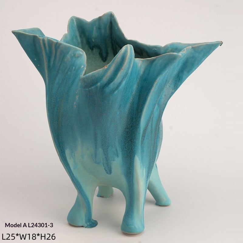Handmade glazed ceramic vase with a smooth matte finish, shown from a side angle highlighting its minimalist silhouette