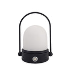 Rechargeable LED atmosphere night light glowing softly on a surface, showcasing its modern minimalist lamp design