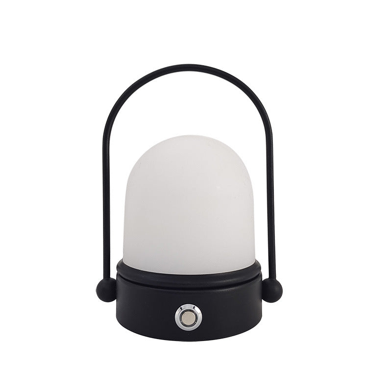 Rechargeable LED atmosphere night light glowing softly on a surface, showcasing its modern minimalist lamp design