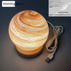 USB lantern night lamp casting a warm rainbow sunset glow on a table as ambient mood lighting