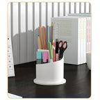 360 rotating makeup brush holder with lid shown open, displaying organized compartments for brushes and beauty tools on a des
