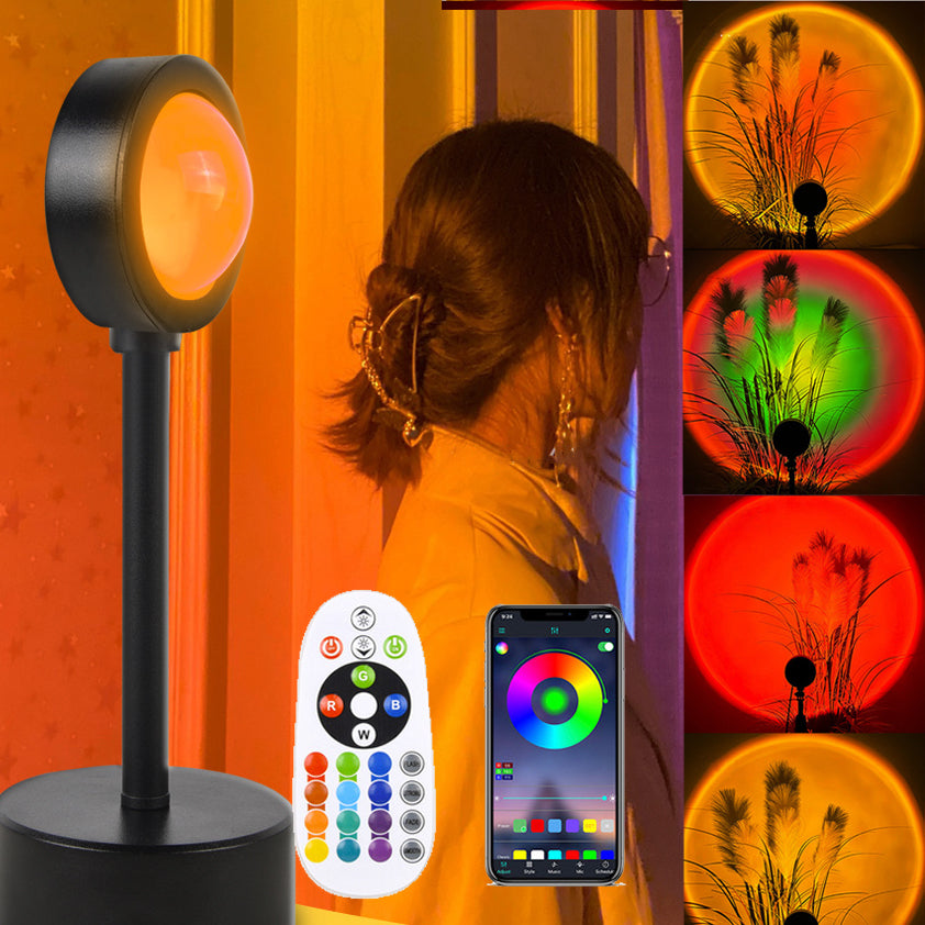 Sunset Projection Lamp casting warm orange and rainbow light across a dark room, showcasing 4 ambient mood lighting modes