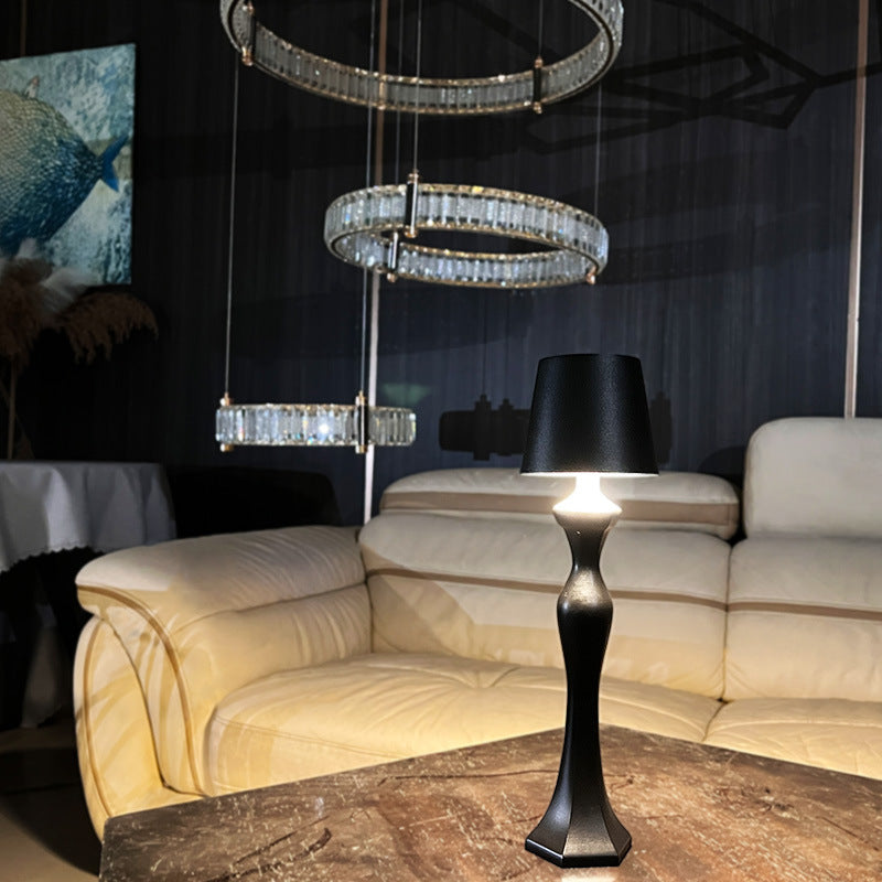 Warm light table lamp casting a soft amber glow on a bedroom nightstand, ideal as a decorative night light