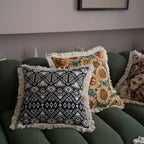 Jacquard floral throw pillow cover with decorative tassel fringe detail, shown as a close-up of the woven texture