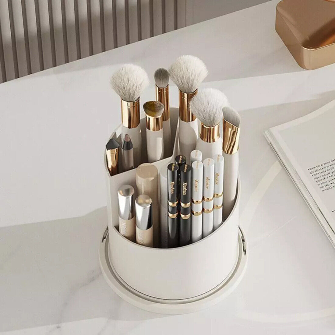 Clear acrylic 360 rotating makeup brush holder with lid open, showing organized compartments for brushes and beauty tools on 