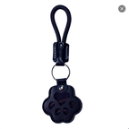 Paw-shaped leather memory keychain holding pet fur, a heartfelt keepsake for dog and cat owners