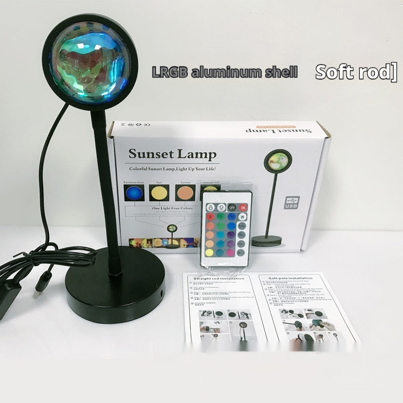 Sunset Projection Lamp casting a warm rainbow gradient glow across a dimly lit room, showcasing its ambient mood lighting eff