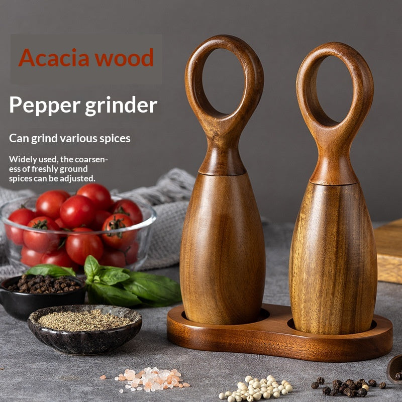 Desert Ironwood pepper mill with manual ceramic grinder, showcasing rich wood grain texture and sleek cylindrical design
