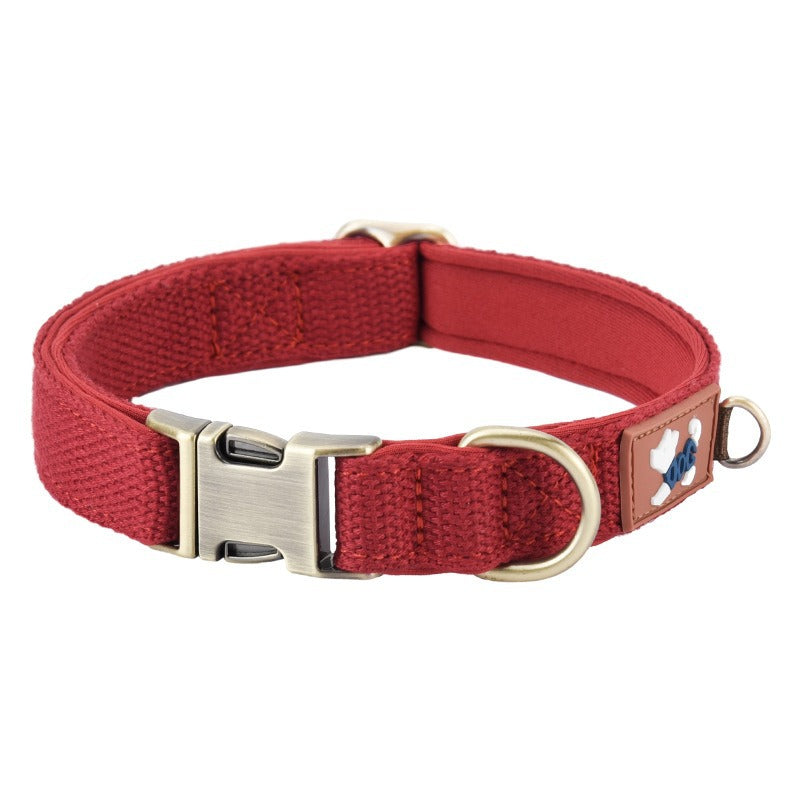Padded dog collar shown from the side, highlighting soft cushioned lining and durable buckle hardware