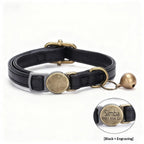 Close-up of a retro-style leather cat collar with vintage buckle hardware, shown flat on a neutral background