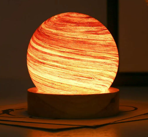 USB lantern night lamp casting a warm rainbow sunset glow on a tabletop as ambient mood lighting