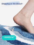 Fluffy wave-shaped bath mat laid flat on bathroom floor, showing soft absorbent texture and non-slip backing