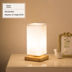 Solid wood table lamp with a Nordic minimalist design, shown from a side angle highlighting the natural wood grain and slim p