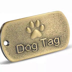 Round silver engraved pet ID tag with custom text, shown close up to display engraving detail