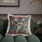 Close-up of jacquard floral throw pillow cover showing intricate woven pattern and decorative tassel trim detail