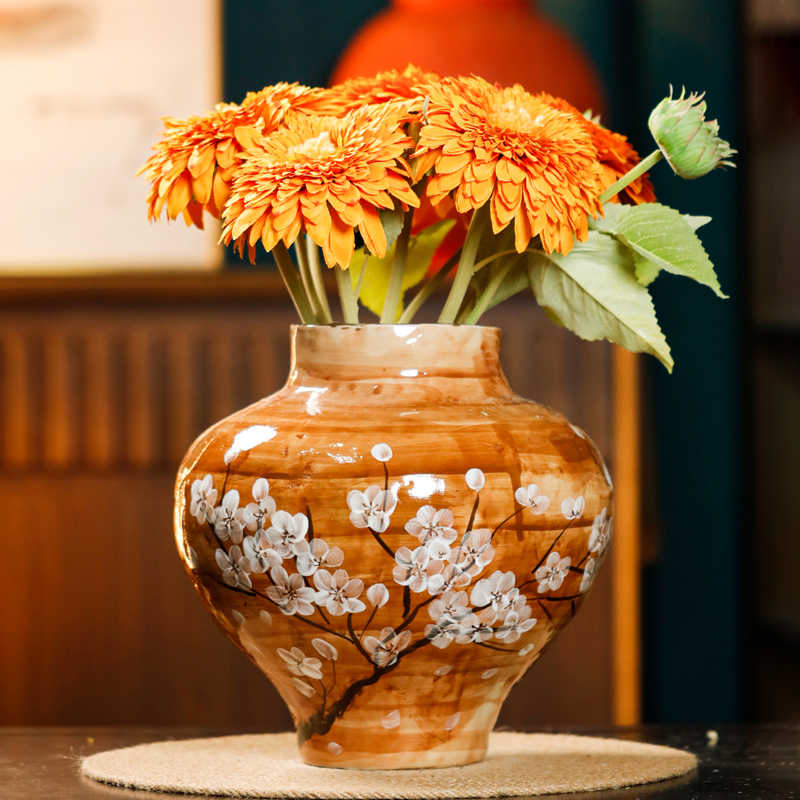 White ceramic hydroponic flower vase with minimalist design, styled as a modern decorative home accent on a neutral surface