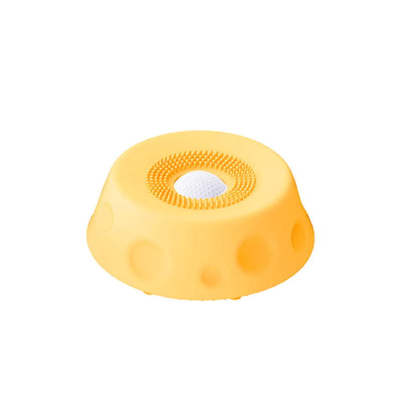 Light blue dog slow feeder lick bowl with rolling ball insert, shown from above on a white background