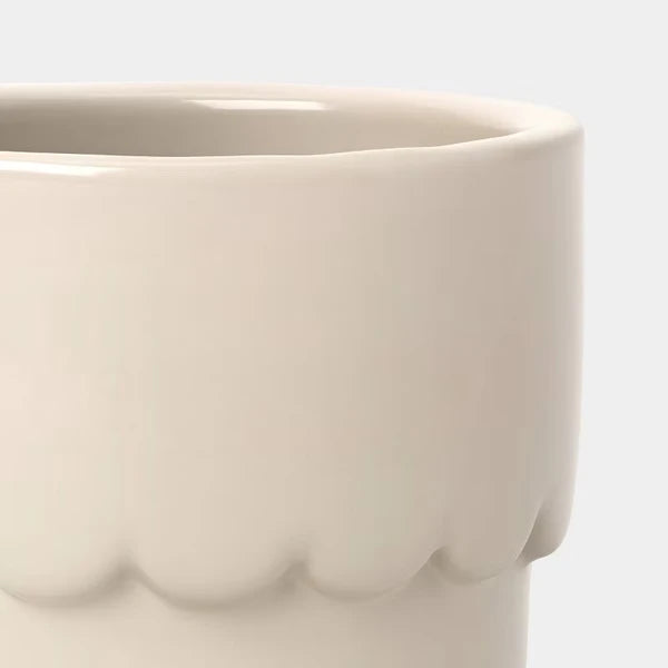 Cream ceramic outdoor planter pot shown from a side angle, ideal for succulents and small plants