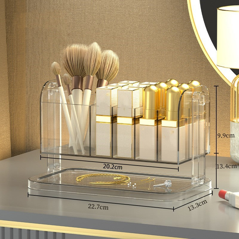 Clear PET rotating makeup organizer box displaying lipsticks and brushes sorted in multiple compartments on a white surface
