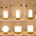 Solid wood table lamp with Nordic minimalist design, shown from a side angle highlighting the natural wood grain and slim pro