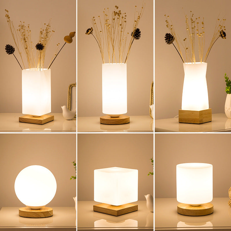 Solid wood table lamp with Nordic minimalist design, shown from a side angle highlighting the natural wood grain and slim pro