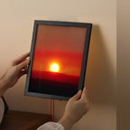 Sunset gradient levitating lamp glowing with warm amber and pink tones as a Tanabata ambient night light on a dark surface