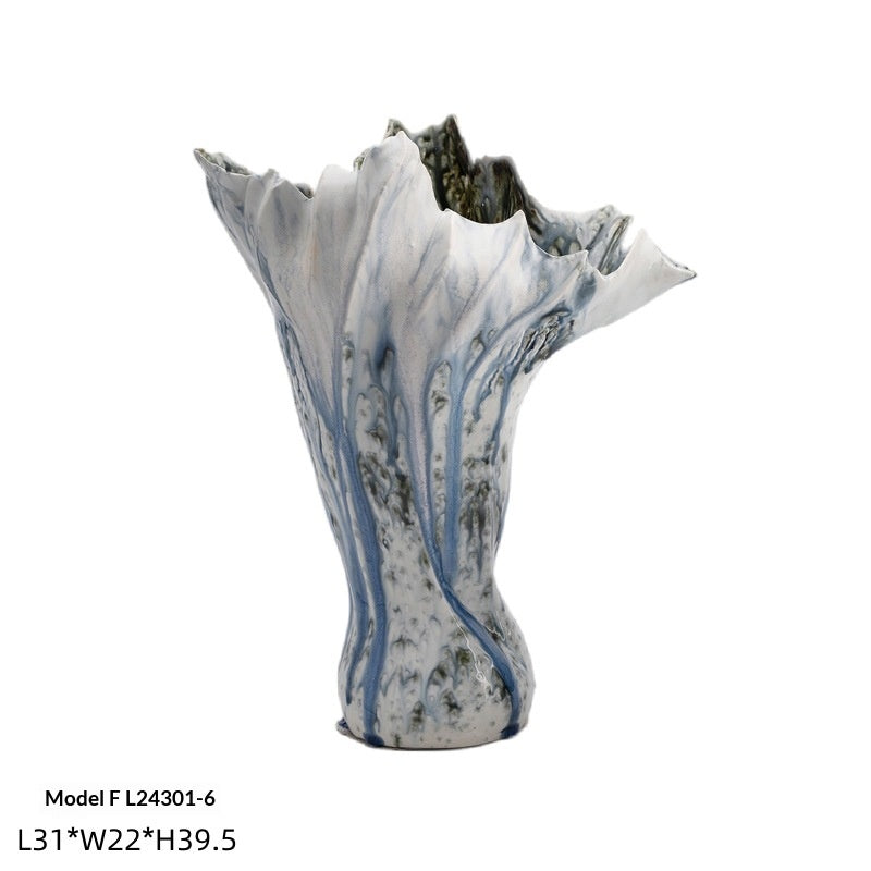 Handmade glazed ceramic vase with a smooth matte finish, shown from a side angle highlighting its minimalist silhouette