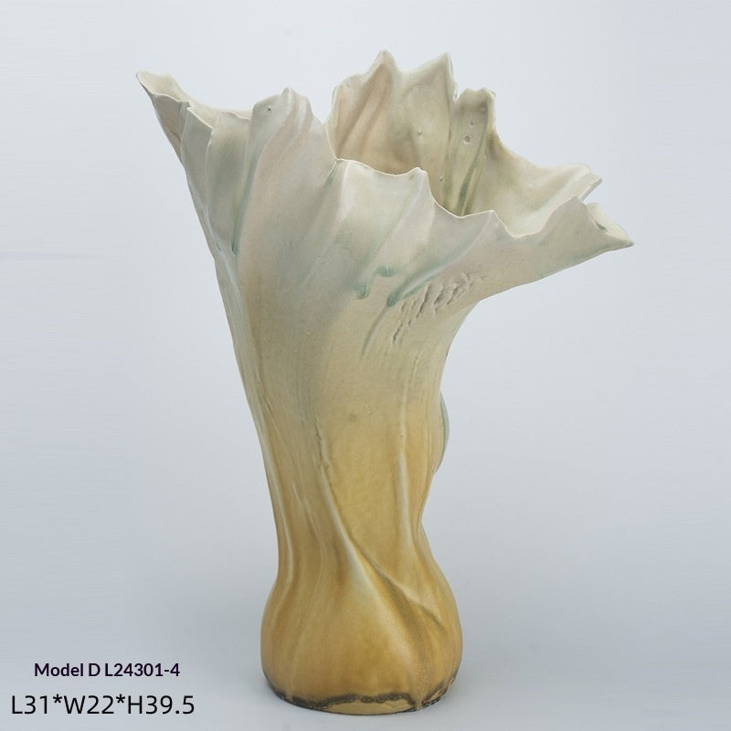 Handmade glazed ceramic vase with a smooth matte finish, shown from a side angle highlighting its minimalist silhouette
