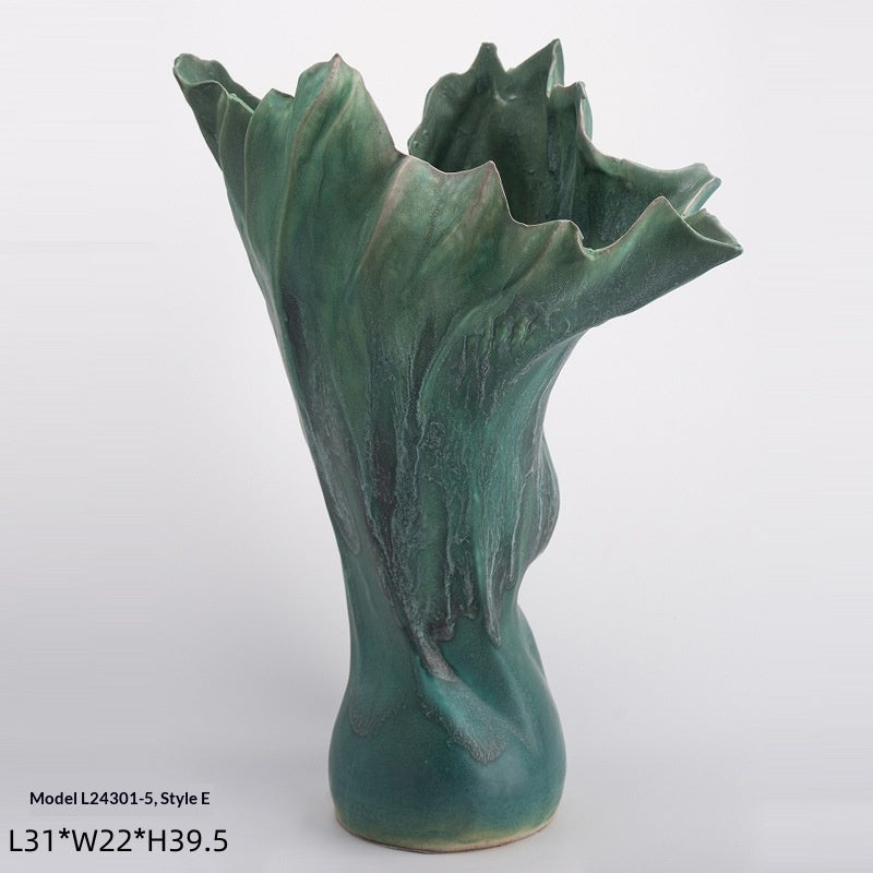 Handmade glazed ceramic vase with a smooth matte finish, shown as a modern minimalist home decor accent piece