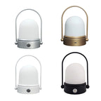 Rechargeable LED atmosphere night light with modern minimalist design, casting a soft warm glow on a bedside table
