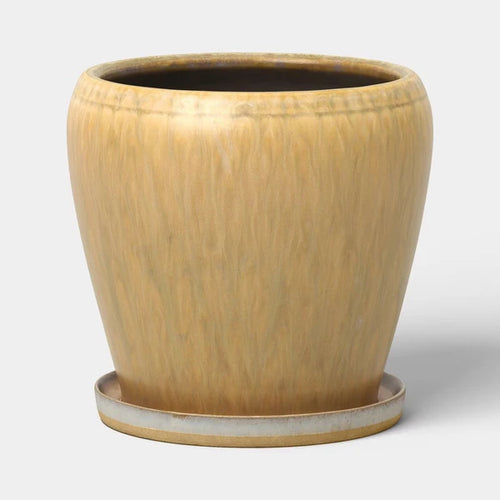 Round 6 inch beige ceramic planter with a mottled reactive glaze finish, shown from a slight angle on a neutral background.