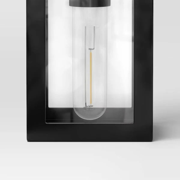 Matte black solar LED lantern path light shown from a close angle highlighting the decorative frame and frosted panel detail