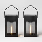 Matte black solar LED lantern path light shown from a side angle, part of a 2-pack set for outdoor use