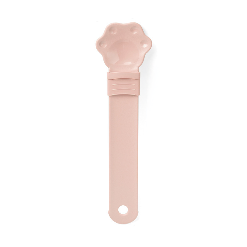 Cat treat squeeze spoon lickable feeder dispenser shown in close-up detail, ideal for hand-feeding cats wet treats