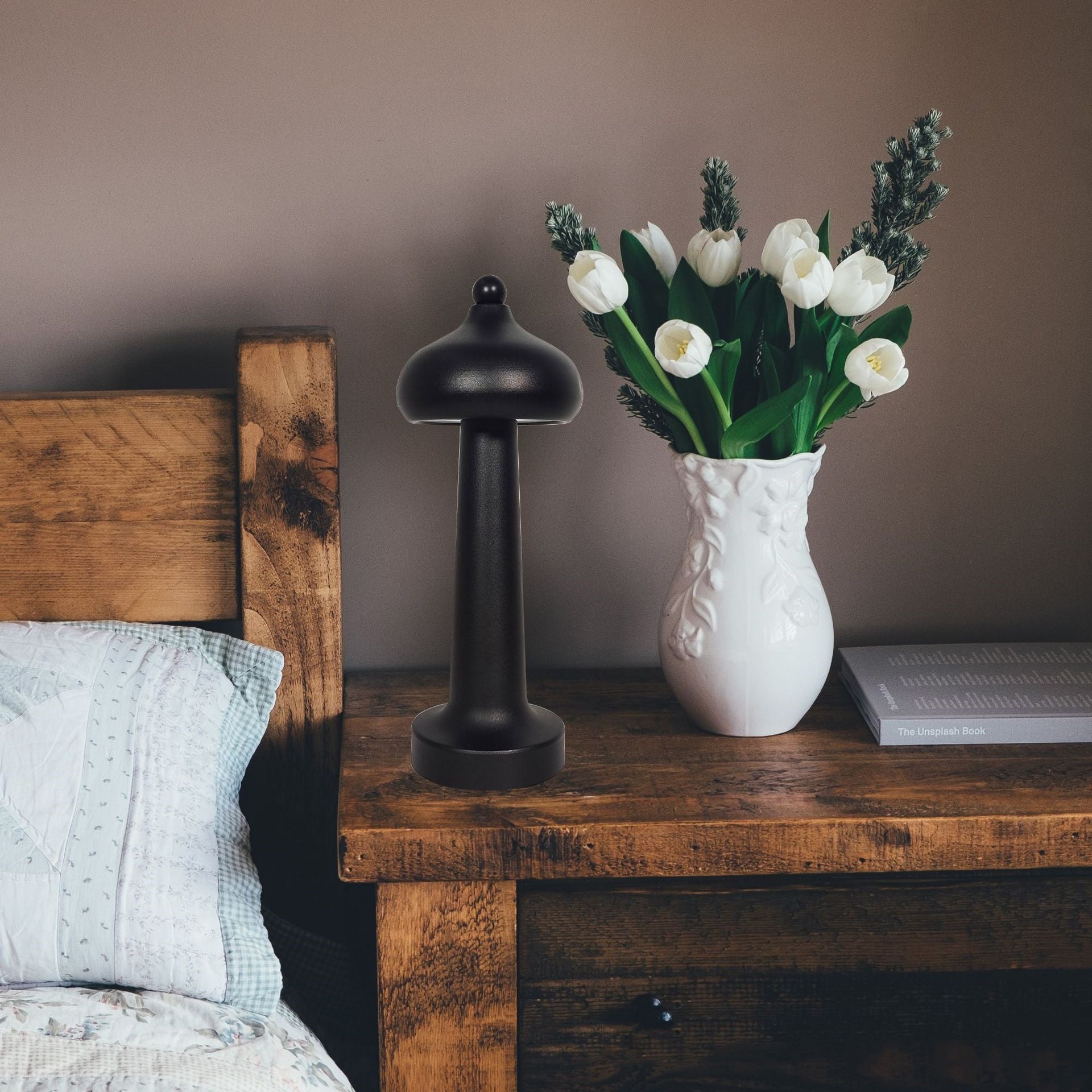 Modern minimalist LED USB table lamp emitting a soft warm glow, shown as a sleek decorative night light on a surface.